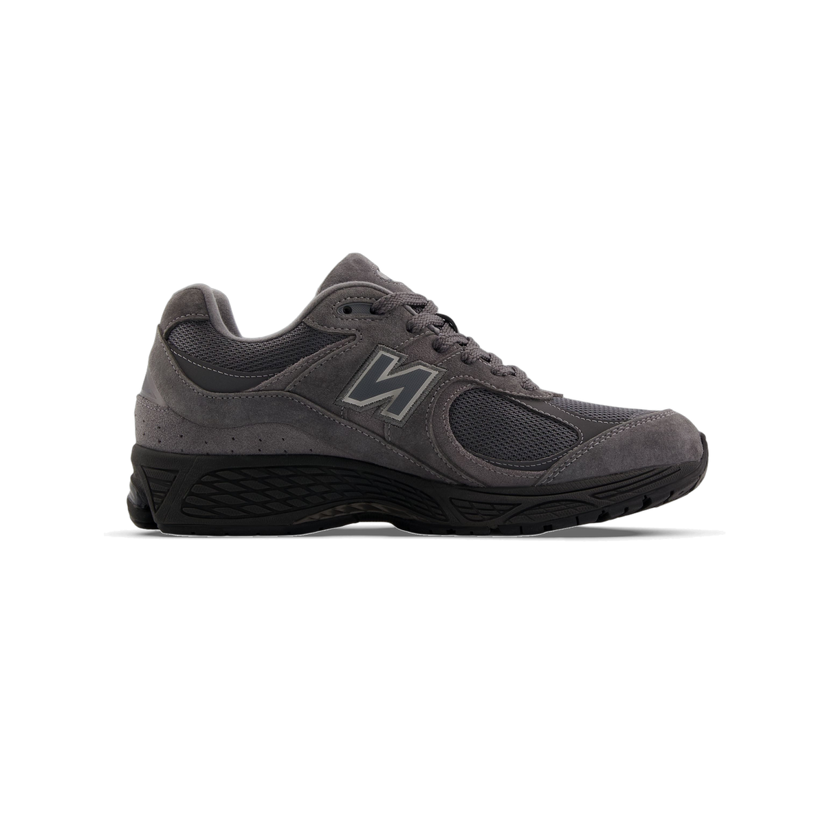 Side view of a gray suede and mesh New Balance 2002R sneaker with a gray N logo and black sole, toe pointing left.