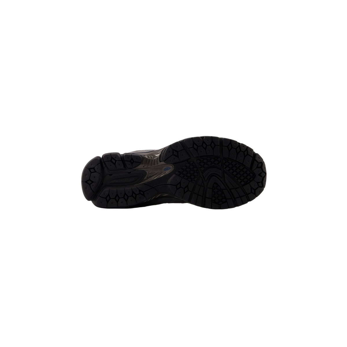 Bottom view of a New Balance 2002R sneaker showing the black textured outsole tread pattern and logo.