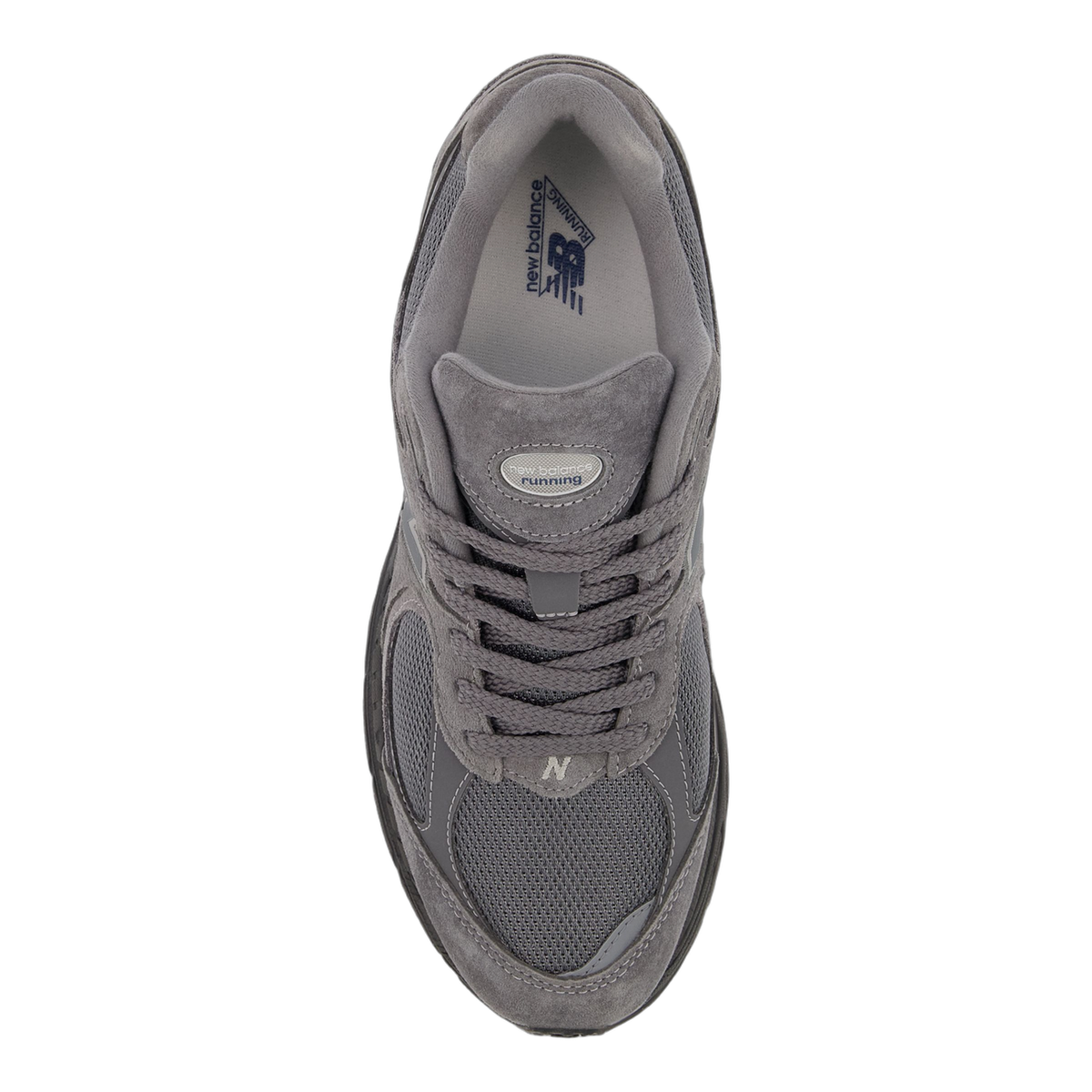 Top-down view of a gray New Balance 2002R sneaker with suede and mesh panels, navy branding on the insole, and an N logo on the side.