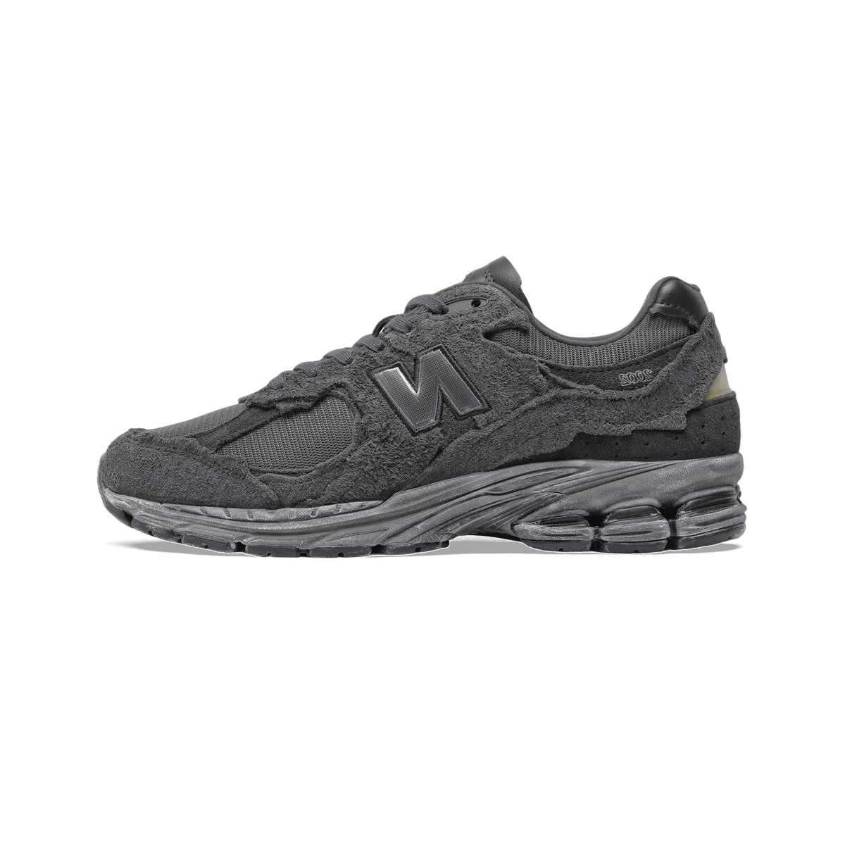 Side view of a dark gray New Balance 2002R sneaker with distressed suede overlays, mesh underlays, and a chunky gray outsole