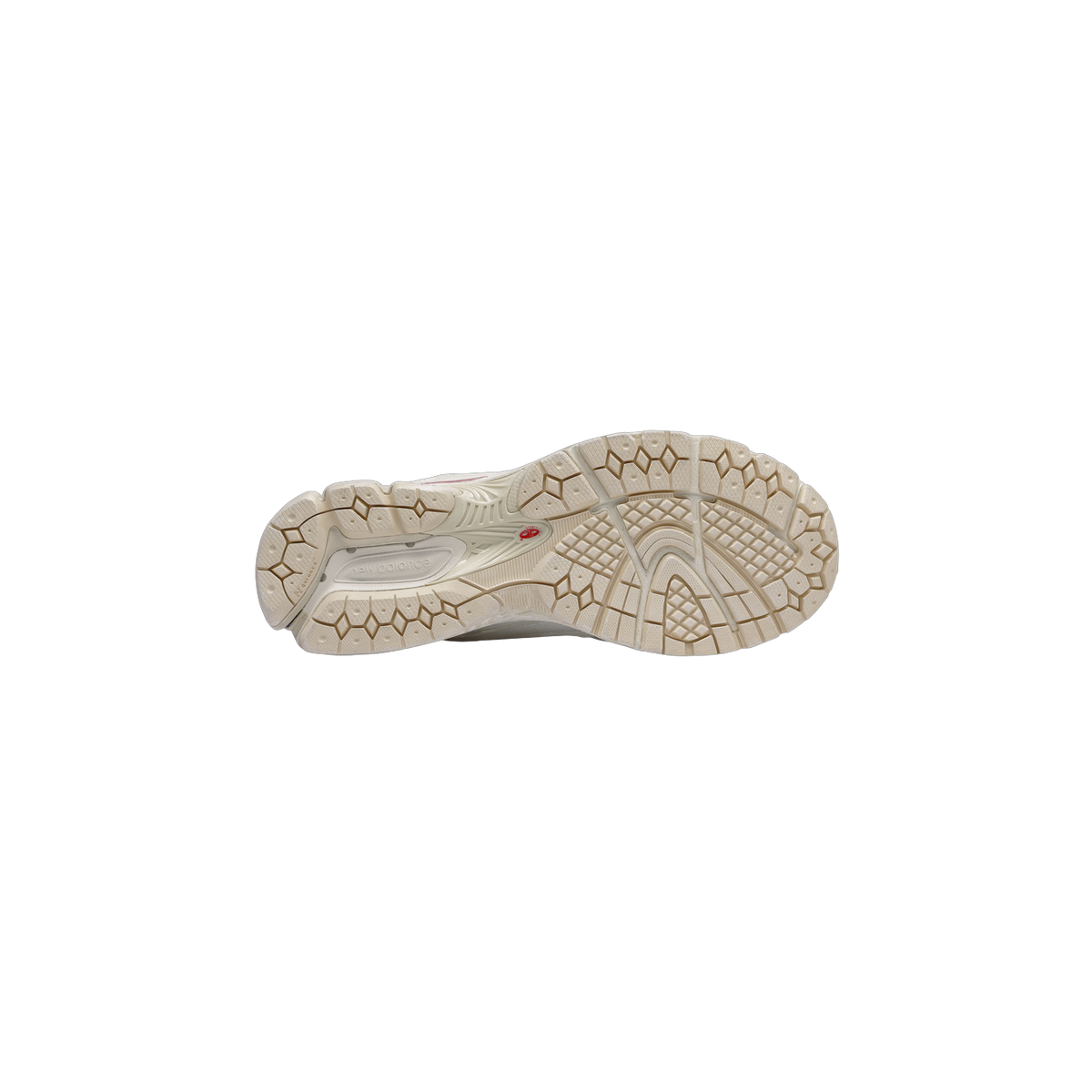 Bottom view of a white New Balance 2002R sneaker showing a tan and cream diamond-patterned outsole with N-durance branding
