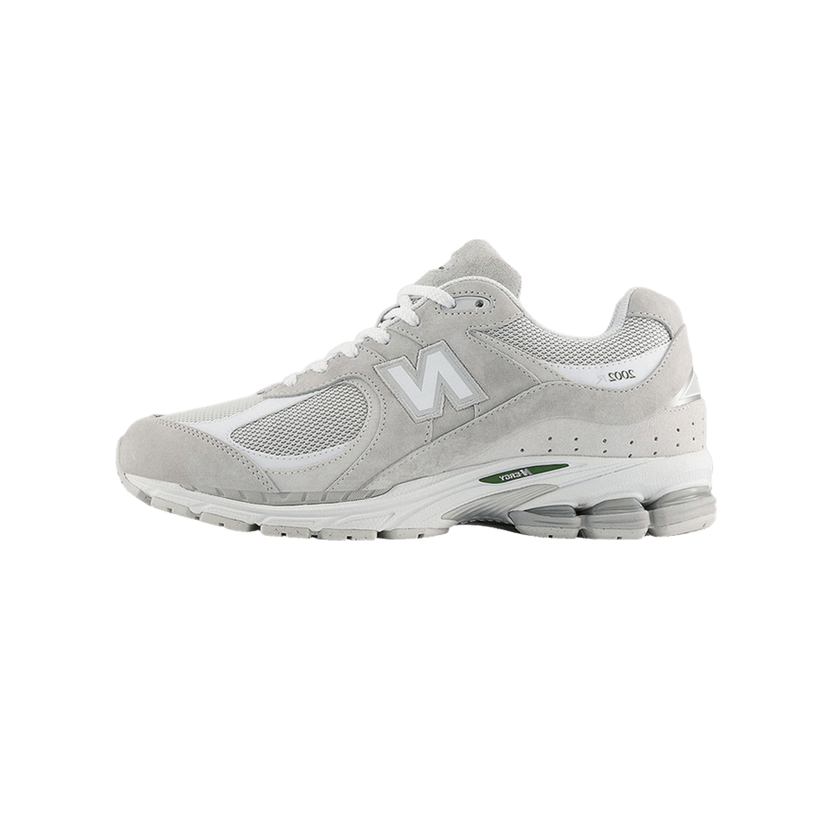Side view of a gray New Balance 2002R sneaker with white N logo, white laces, mesh toe panel, and green accent on the midsole, toe pointing left.