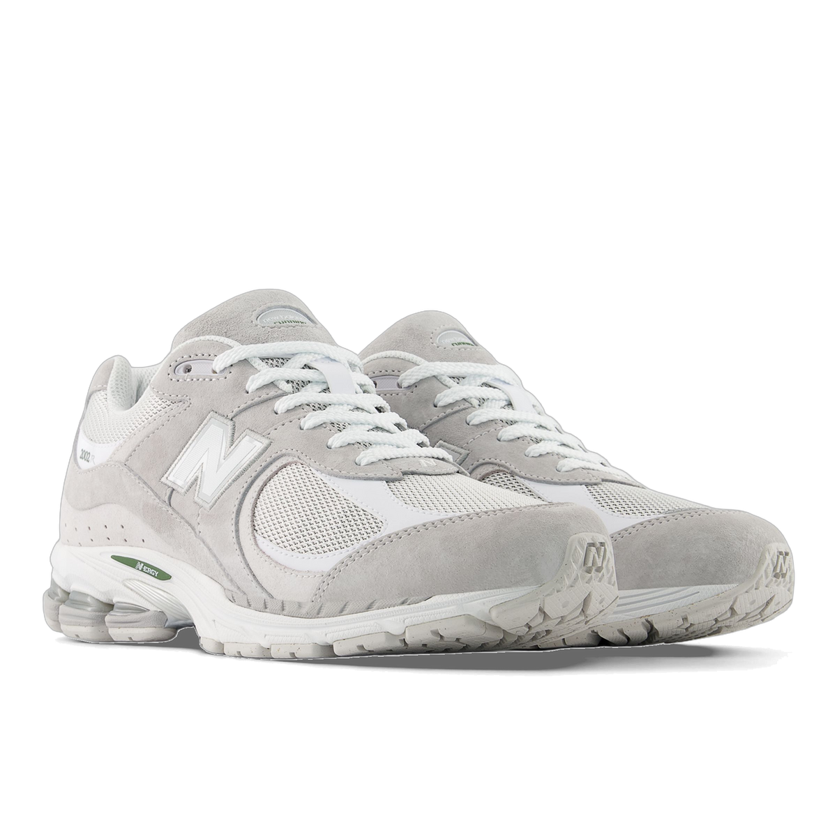 Pair of gray and white New Balance 2002R sneakers with mesh panels, suede overlays, and white N logo, angled toward the left
