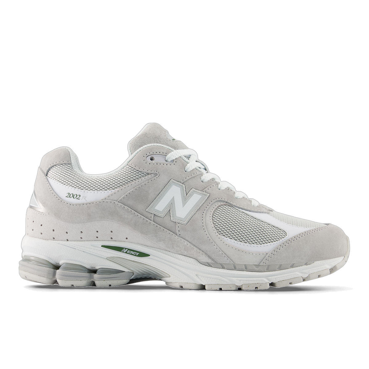 Side view of a grey New Balance 2002R sneaker with white mesh panels, white N logo, and green accent text on the midsole, toe pointing left
