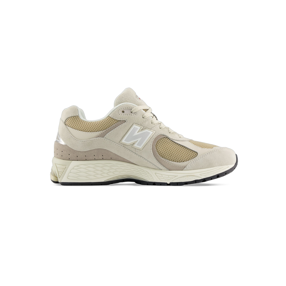 Side view of a beige New Balance 2002R sneaker with tan mesh panels, suede overlays, a white N logo, and a cream midsole with black outsole.