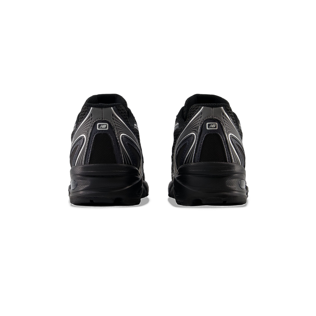 Rear view of a pair of black New Balance 740v2 sneakers with silver accents and New Balance logo on the heel tabs