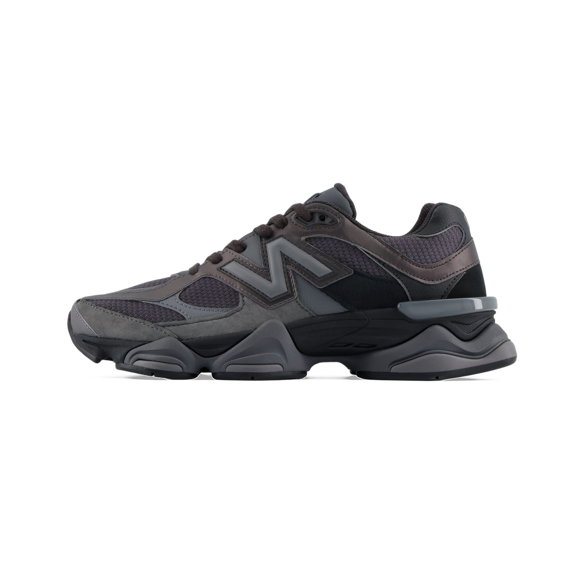 Side view of a black and grey New Balance 9060 sneaker with a chunky midsole and grey N logo on the lateral panel