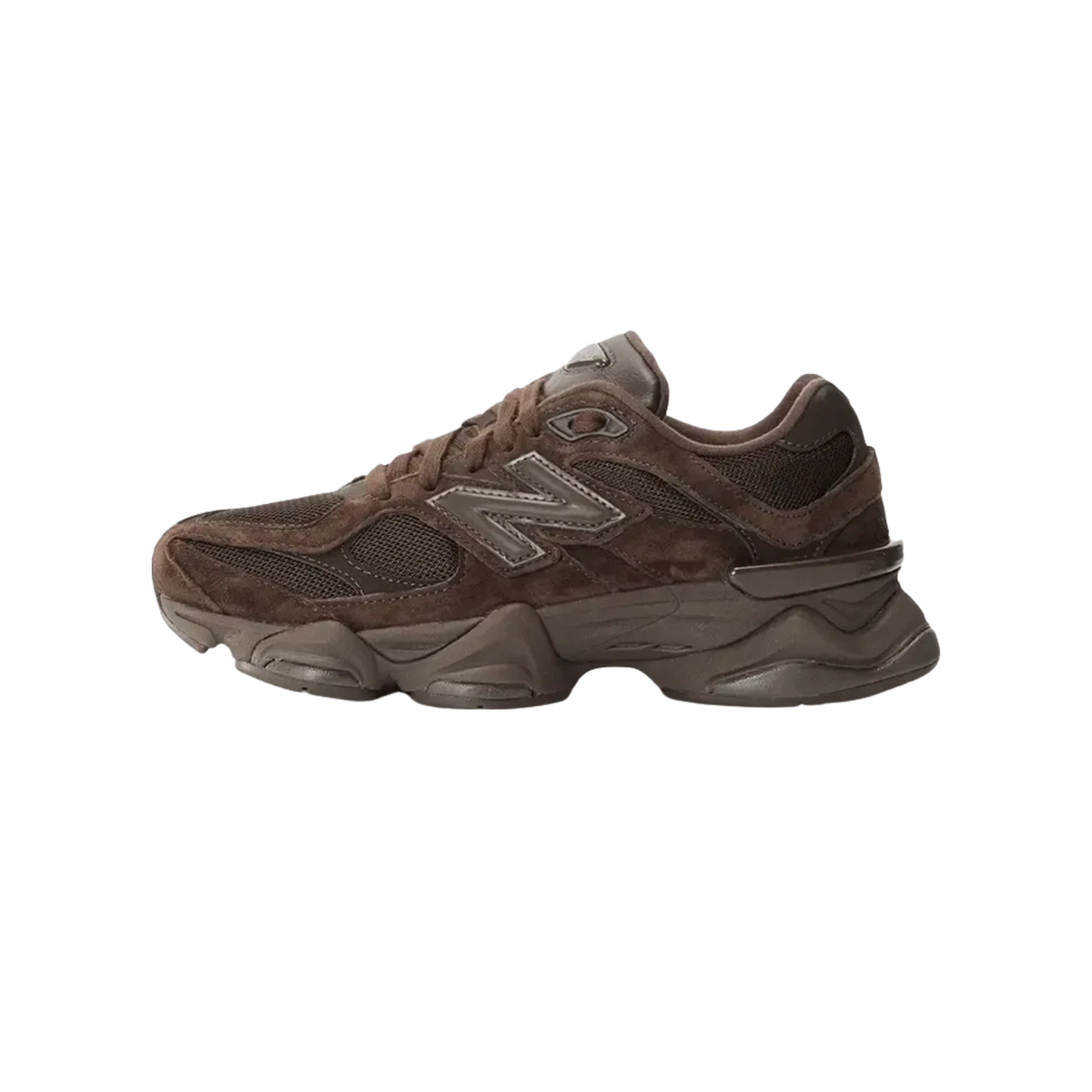 Side view of a brown New Balance 9060 sneaker with toe pointing left, showing the tonal N logo, suede and mesh panels, and chunky layered midsole.