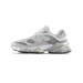 Left side view of a gray and beige New Balance 9060 sneaker with mesh panels and the N logo, toe pointing left
