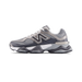 Left New Balance 9060 sneaker in gray and silver tones shown from the side with toe pointing left, featuring a large N logo and chunky layered sole.
