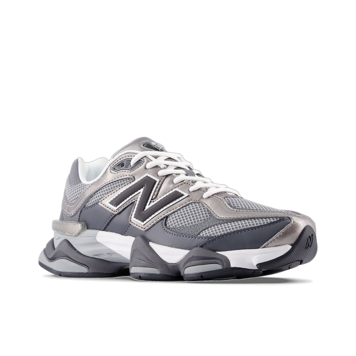 Side view of a gray and silver New Balance 9060 sneaker with white laces and a dark N logo on the lateral side, toe pointing left