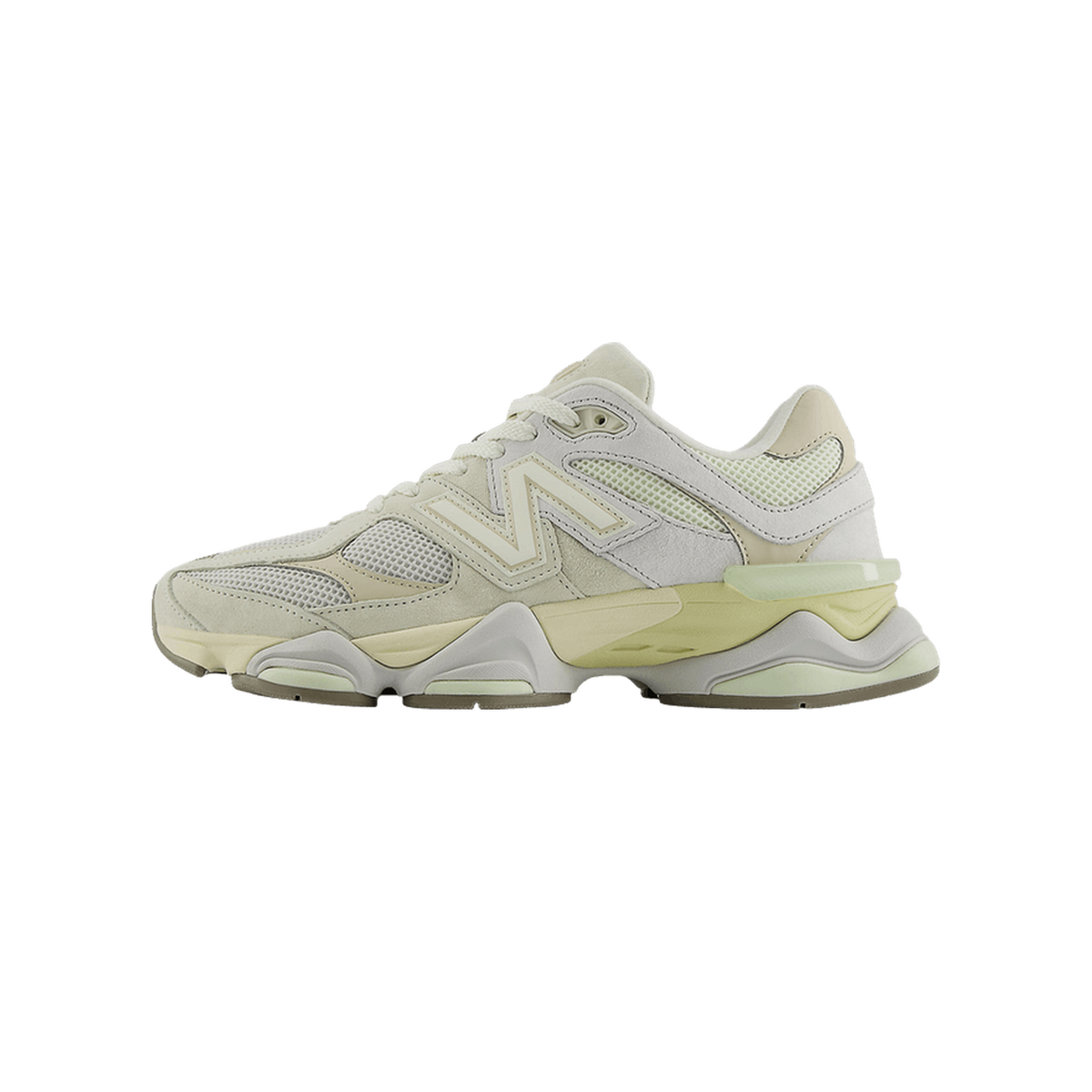 Side view of a cream and off-white New Balance 9060 sneaker with toe pointing left, showing the N logo, mesh panels, and chunky translucent midsole