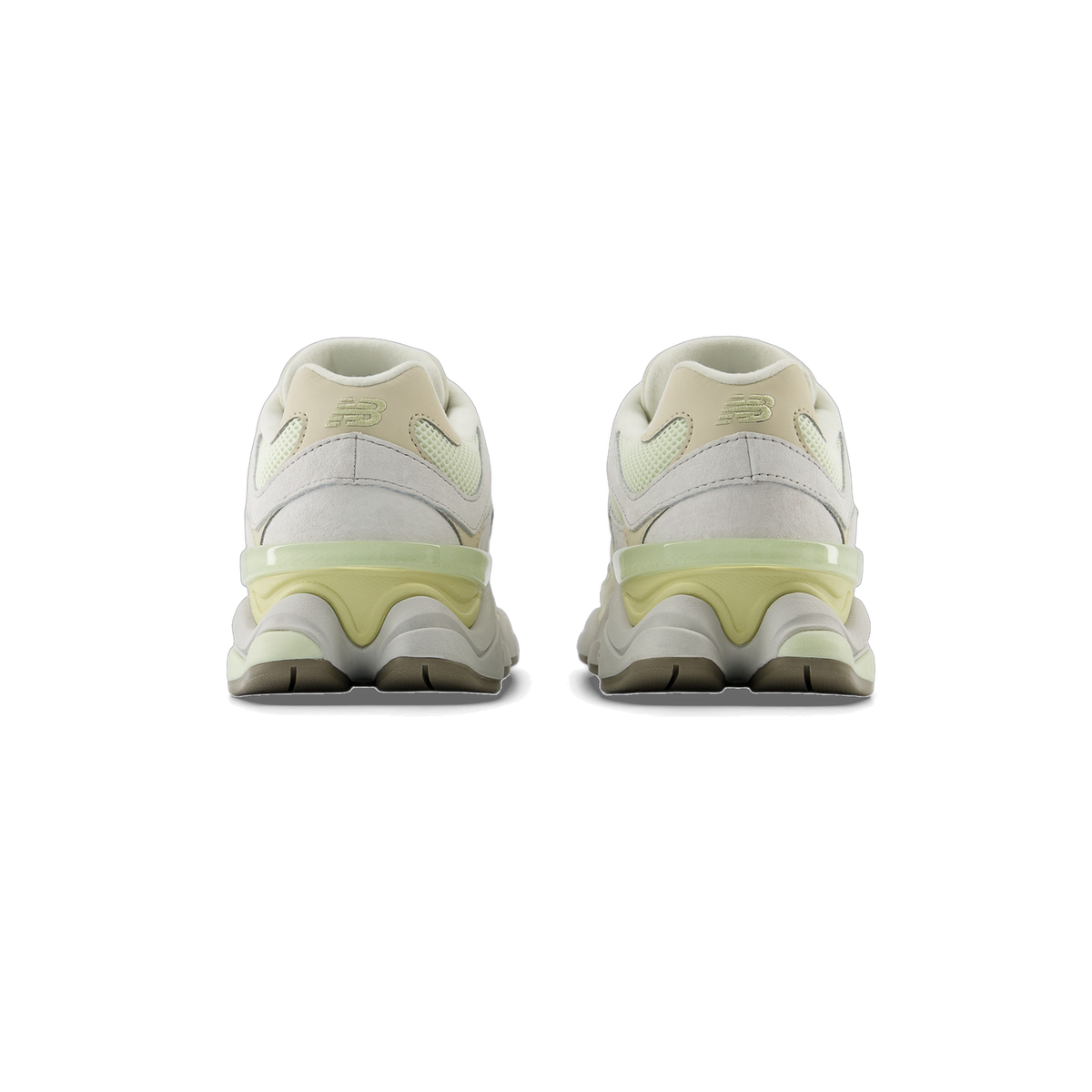 Rear view of a pair of New Balance 9060 sneakers in light gray and pale green with tan heel panels and embroidered NB logos