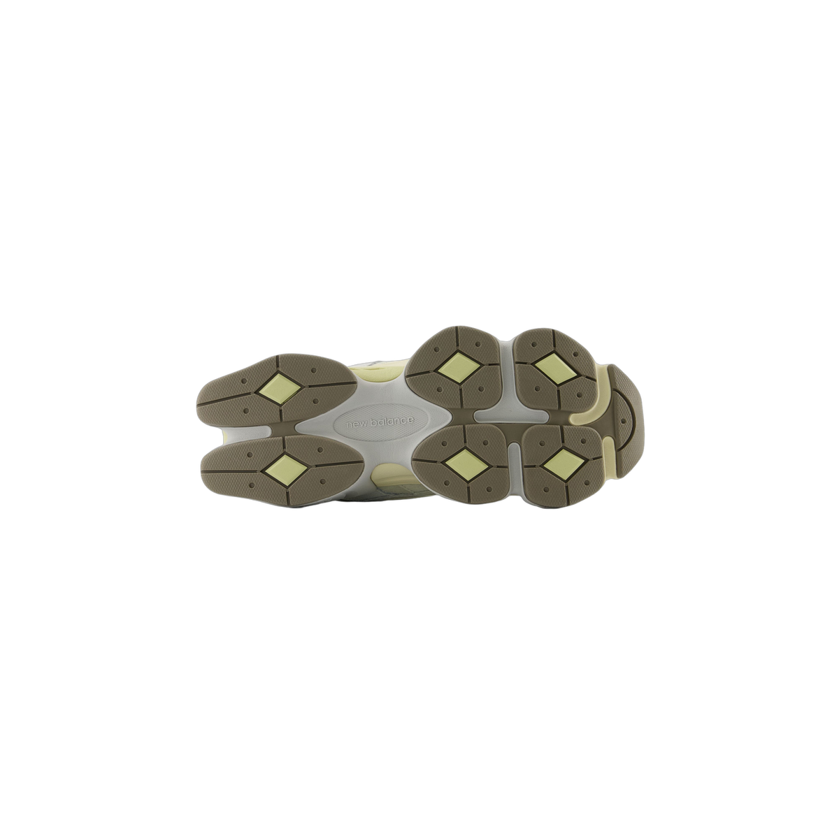 Bottom view of a New Balance 9060 sneaker showing a white, brown, and pale yellow diamond-patterned rubber outsole with the New Balance logo in the center
