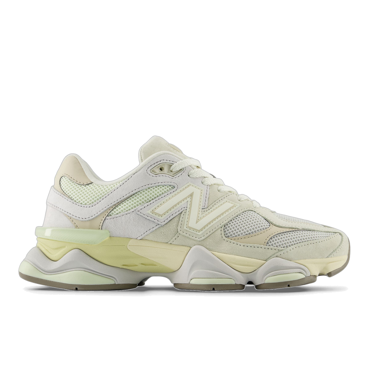 Side view of a cream New Balance 9060 sneaker with pale green mesh panels, suede overlays, a chunky midsole, and the N logo on the lateral side, toe pointing left.
