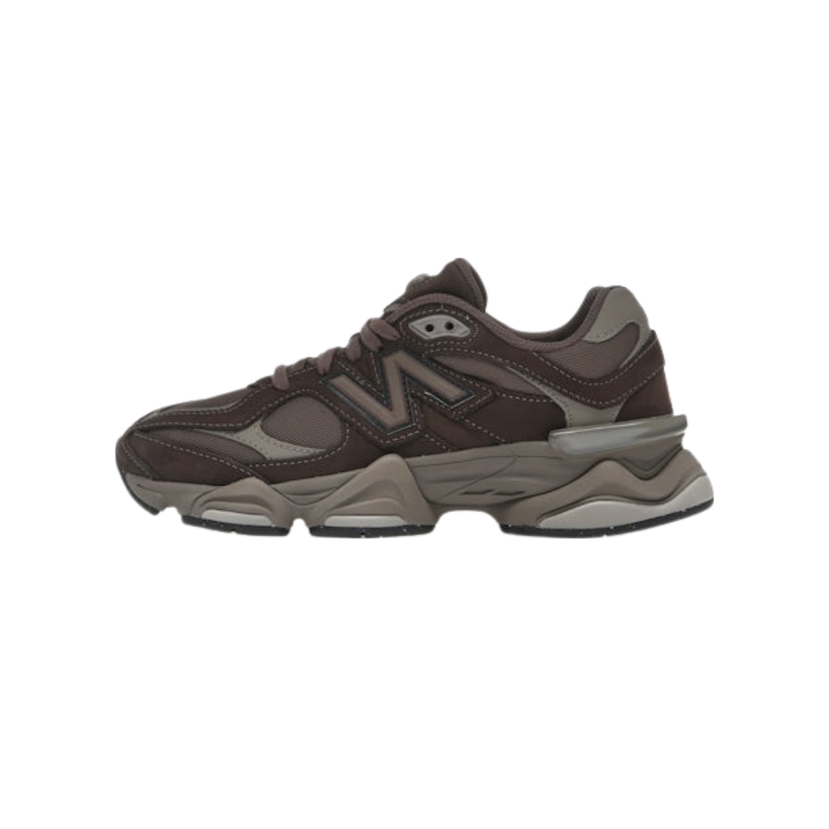 Side view of a brown New Balance 9060 sneaker with tonal suede and mesh panels, chunky layered sole, and a grey heel clip featuring the N logo.
