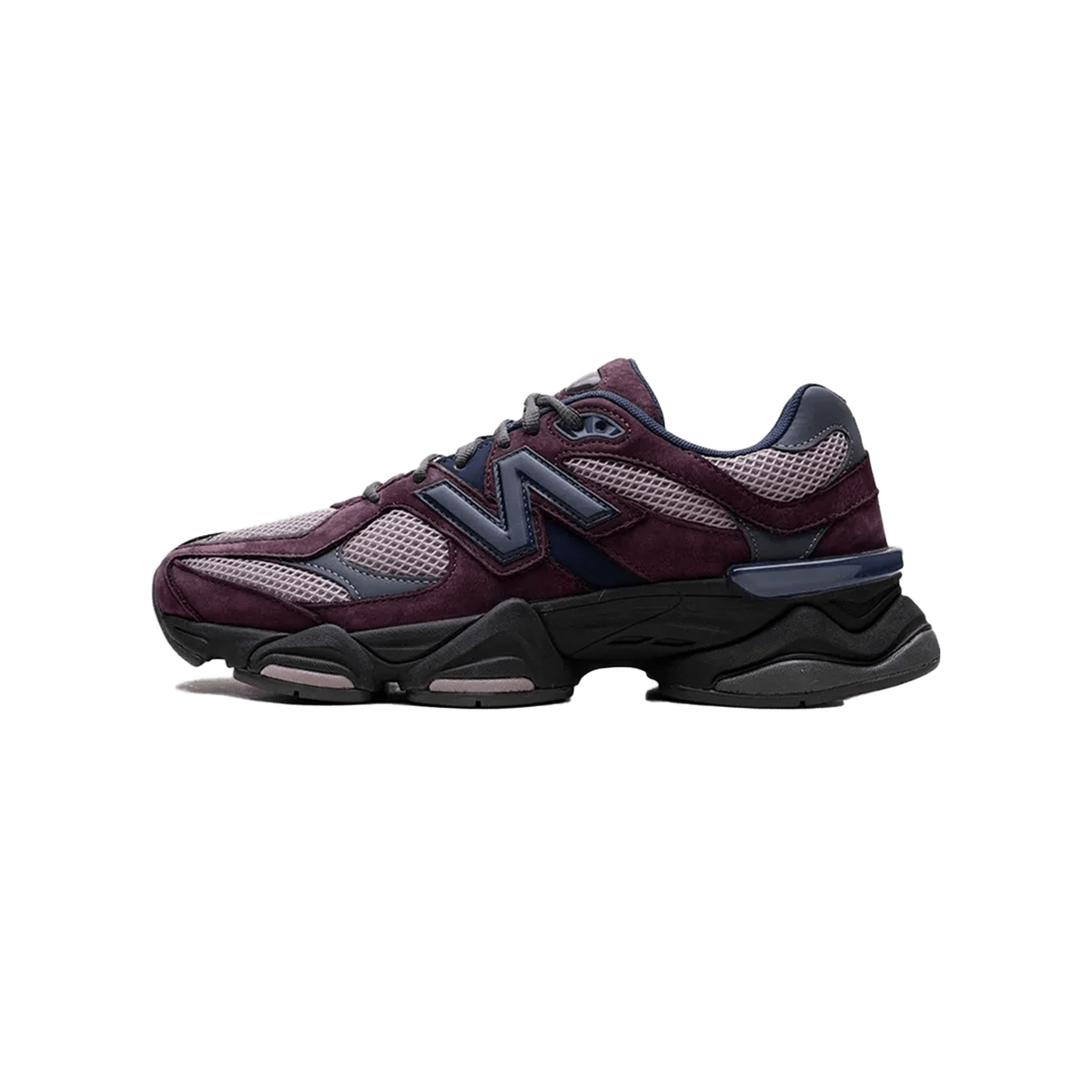Left New Balance 9060 sneaker in plum and mauve with navy N logo and black chunky midsole, shown from the outside toe-left angle.