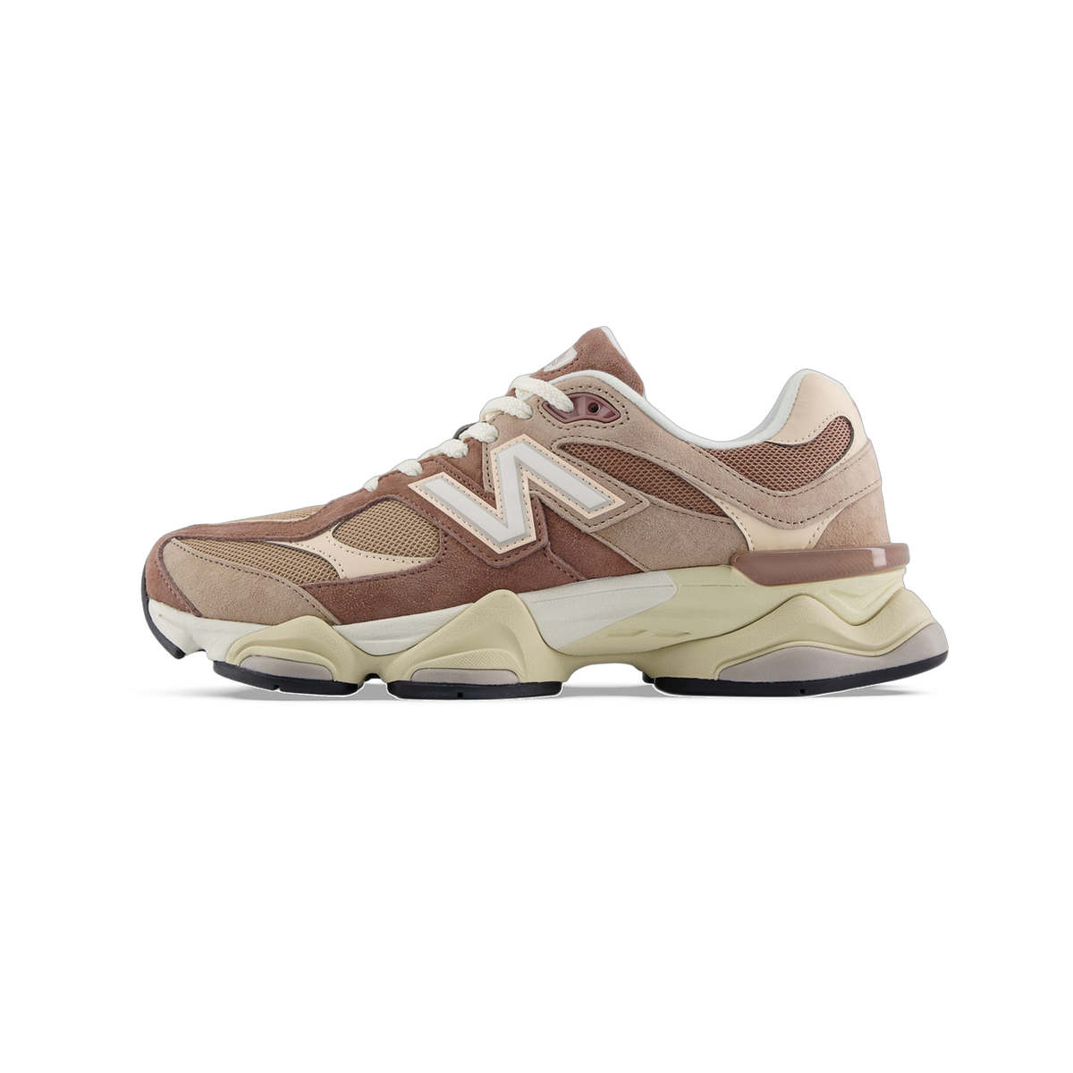 Side view of a New Balance 9060 sneaker in brown and tan suede and mesh with a cream chunky sole and white N logo