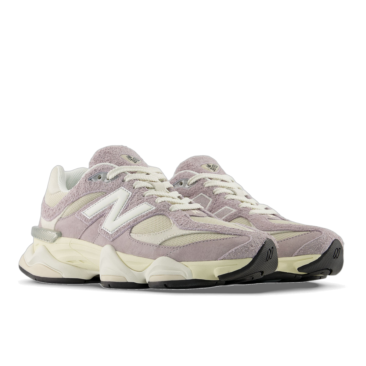 Pair of New Balance 9060 sneakers in lavender suede and cream mesh with white N logos, angled toward the left.
