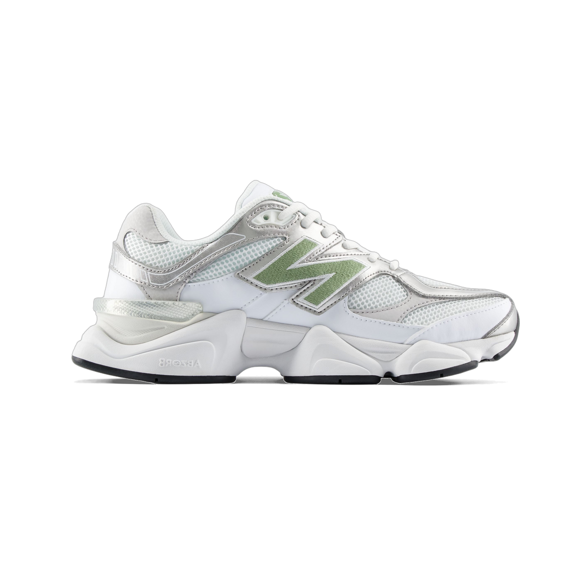 Side view of a white New Balance 9060 sneaker with a sage green N logo, silver overlays, and a chunky white midsole with black outsole, toe pointing left.