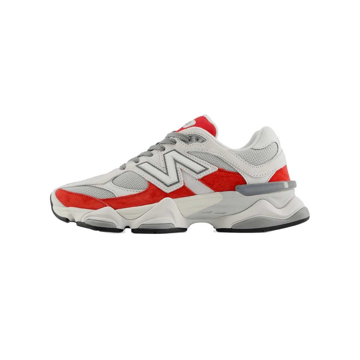 Side view of a white and red New Balance 9060 sneaker with toe pointing left, showing the white N logo and chunky grey midsole.