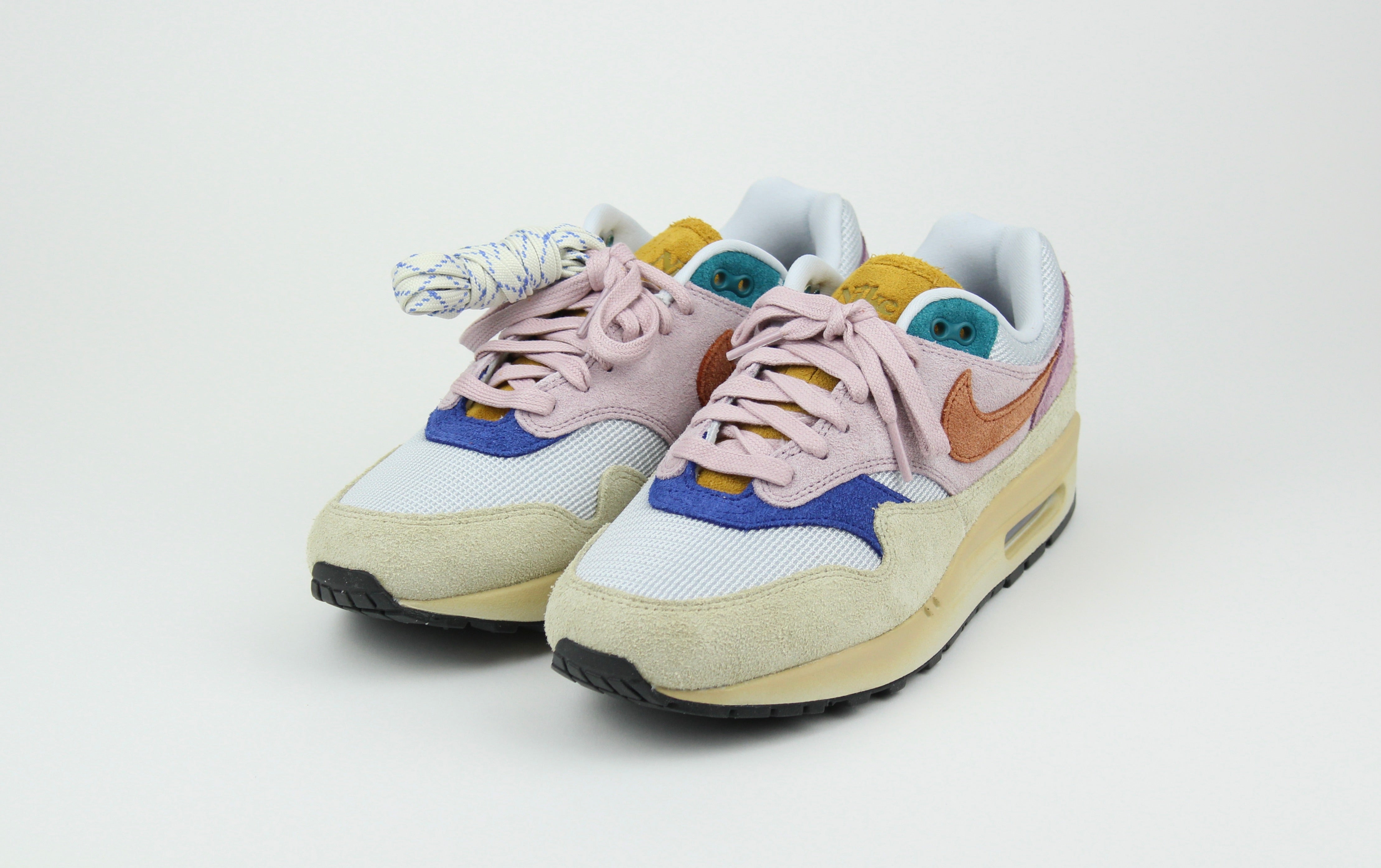 Nike Air Max 1 ’87 Premium “Tan Lines” with patchwork suede panels in Plum Fog and Burnt Sunrise. December 2023 release. Shop now!