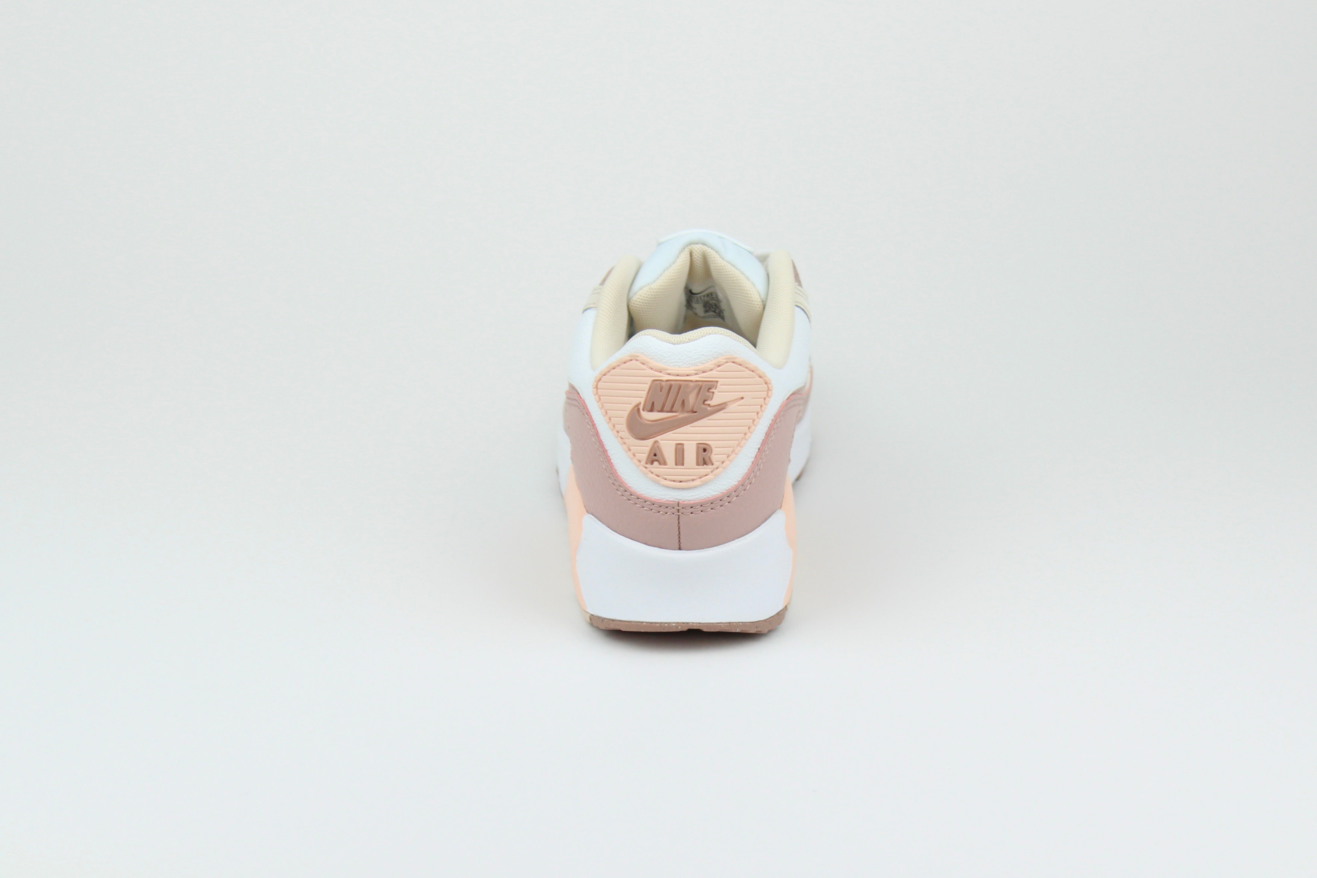 Eco‑friendly Air Max 90 in “Washed Coral” & “Particle Pink” with visible Air cushioning. Limited July 2025 release. Shop now at The Attic!