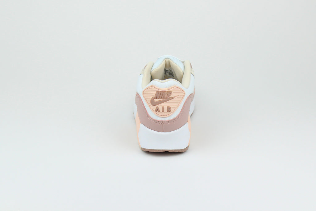 Eco‑friendly Air Max 90 in “Washed Coral” & “Particle Pink” with visible Air cushioning. Limited July 2025 release. Shop now at The Attic!