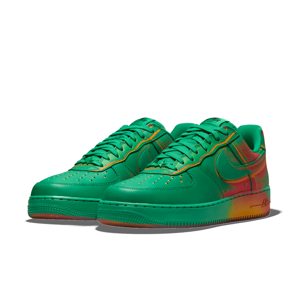 Pair of green Nike Air Force 1 Low sneakers with a red and yellow spray-paint style gradient fading across the heel and midsole, angled toward the left.