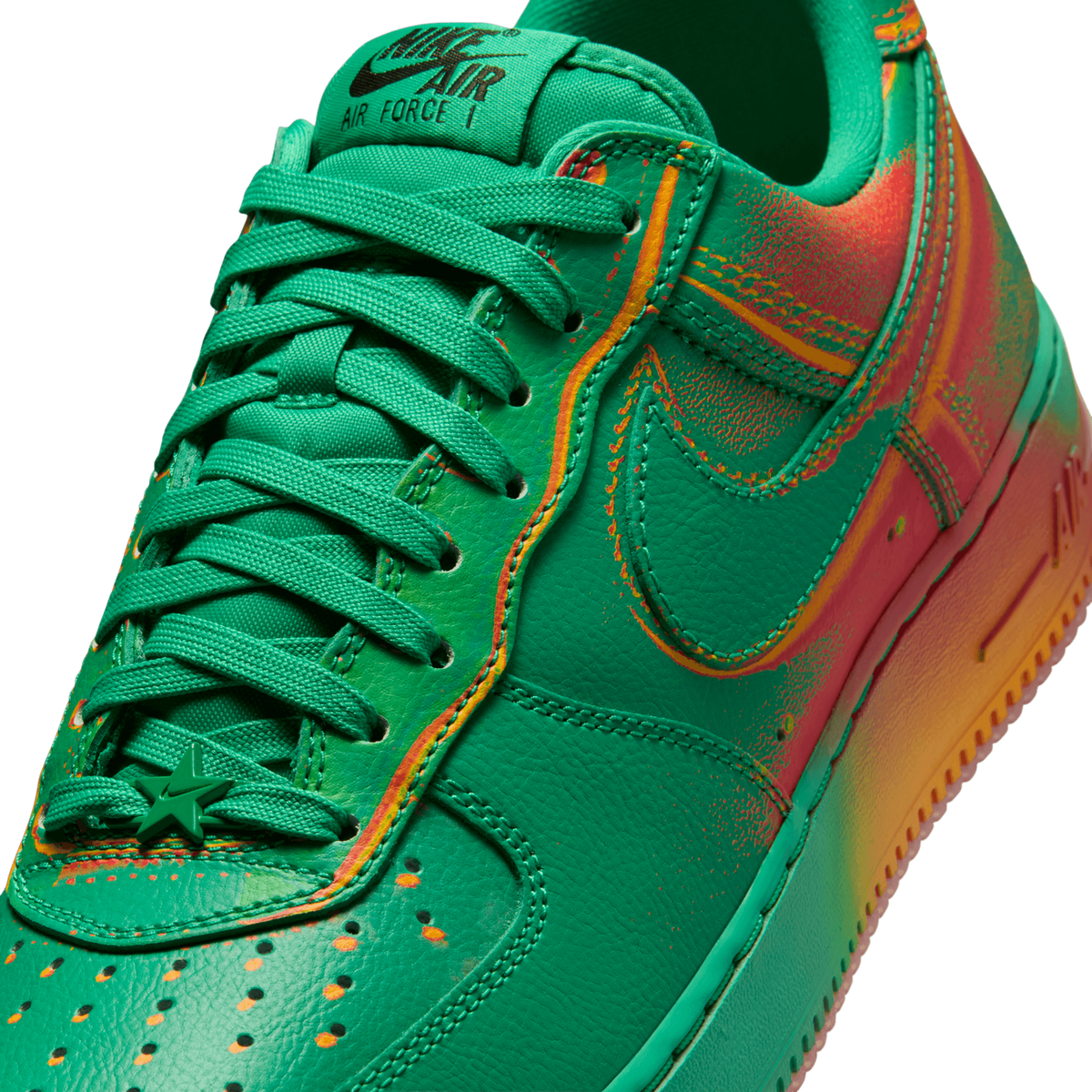 Close-up angled view of a green Nike Air Force 1 toe box and tongue with a thermal-style red and orange gradient print and a star-shaped lace lock.