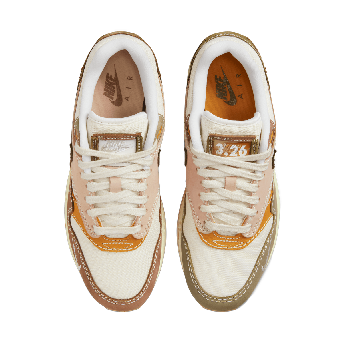Top-down view of a pair of Nike Air Max 1 Premium Wabi-Sabi sneakers in beige, tan, brown and orange with contrasting stitching and a small 3.26 date graphic on the tongue tabs