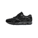 Lateral view of a black Nike Air Max 1 with white sketch-style stitching and handwritten construction annotations covering the upper.