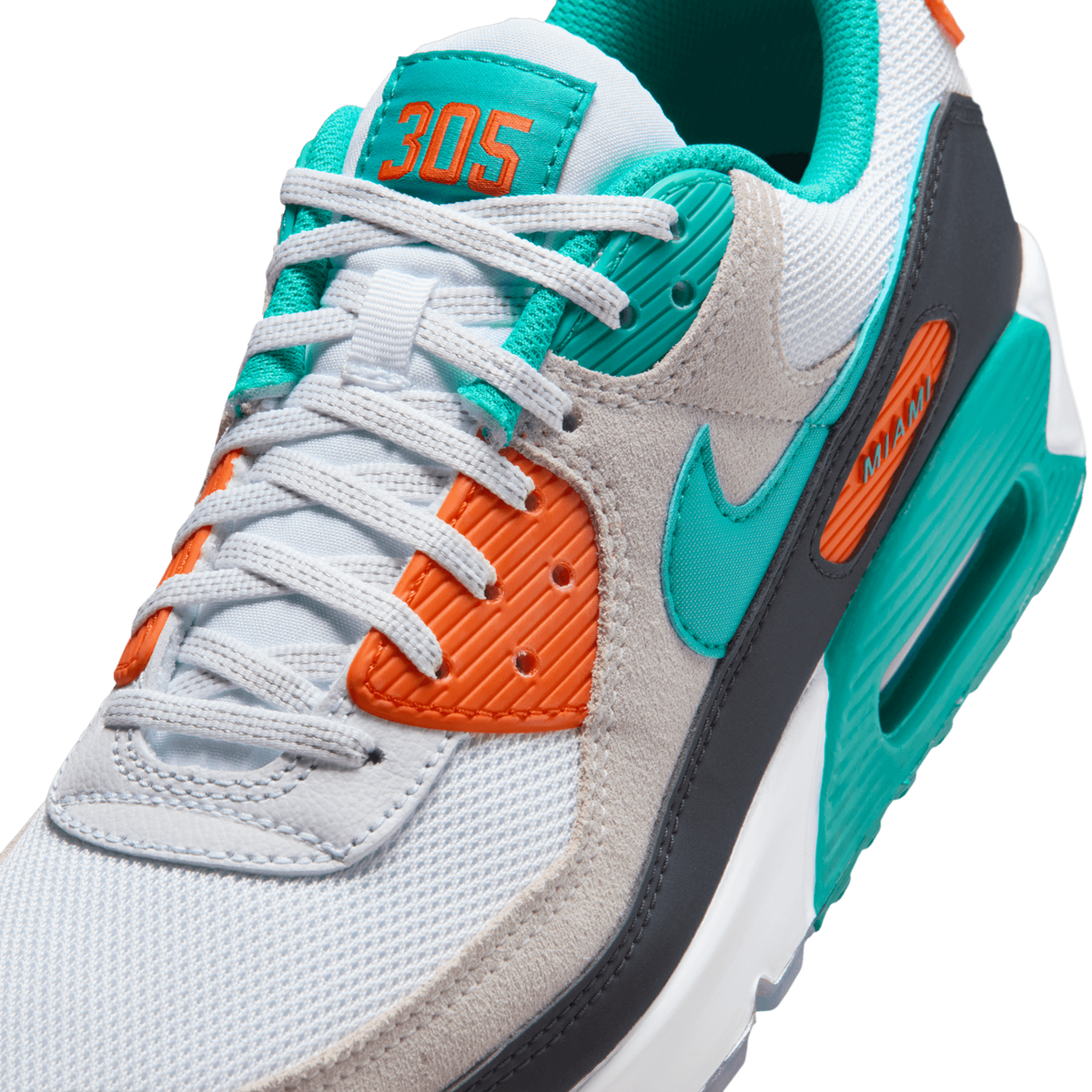 Close-up angled view of a white Nike Air Max 90 sneaker with teal swoosh, orange eyestay, teal '305' tongue tab, and 'MIAMI' text on the midsole