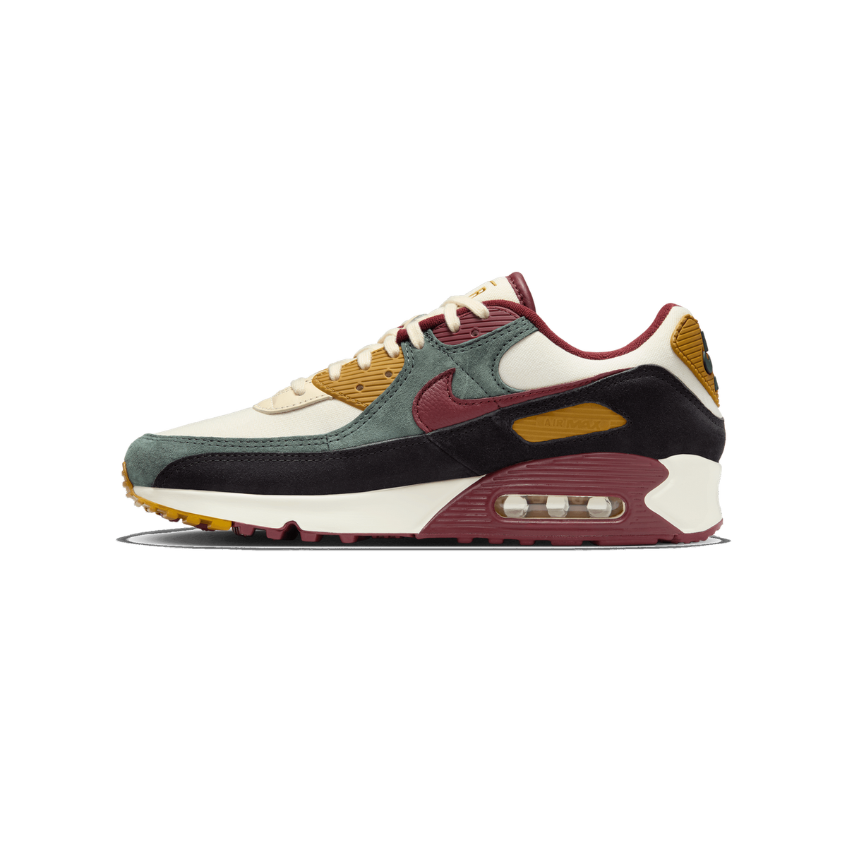 Left Nike Air Max 90 sneaker shown from the side with toe pointing left, featuring cream, sage green, black, burgundy, and mustard yellow panels and a visible Air cushioning unit in the heel.