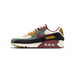 Left Nike Air Max 90 sneaker shown from the side with toe pointing left, featuring cream, sage green, black, burgundy, and mustard yellow panels and a visible Air cushioning unit in the heel.
