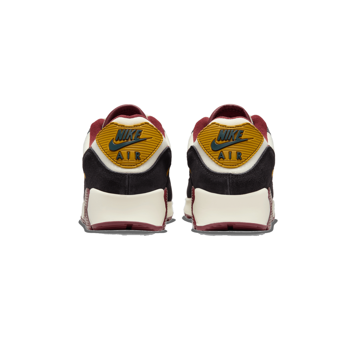 Rear view of a pair of Nike Air Max 90 sneakers with black suede heels, cream midsoles, burgundy trim, and yellow Nike Air heel tabs with a teal swoosh logo.