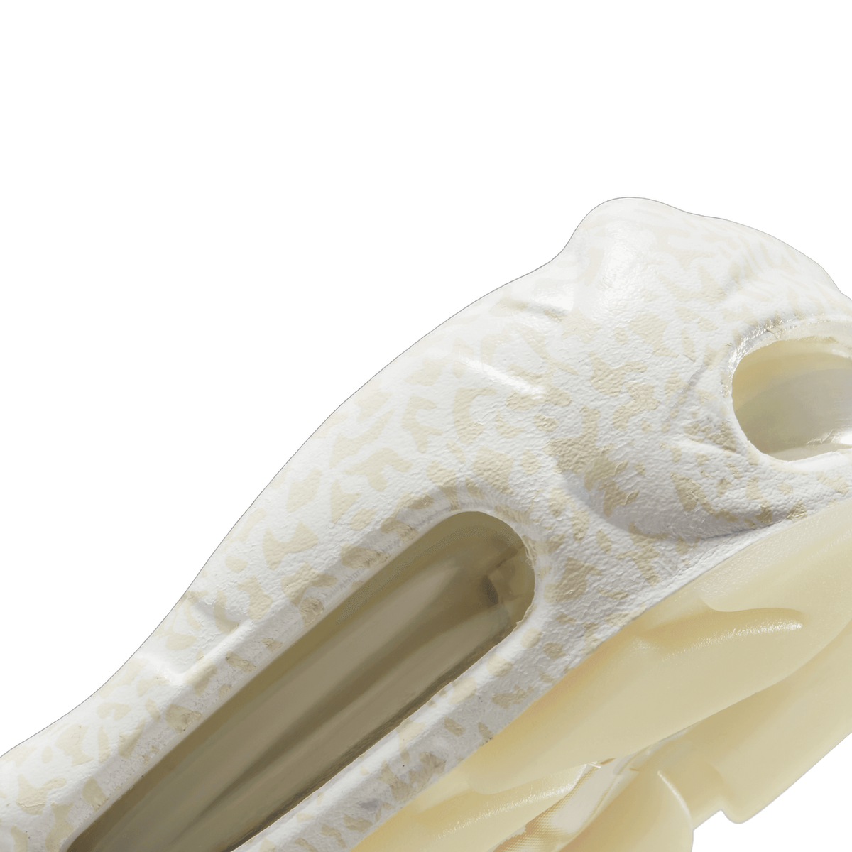 Close-up detail of a Nike Air Max 95 showing a white Swoosh on a grey and light grey textured upper, with a cream-and-white speckled midsole and a visible clear air unit.