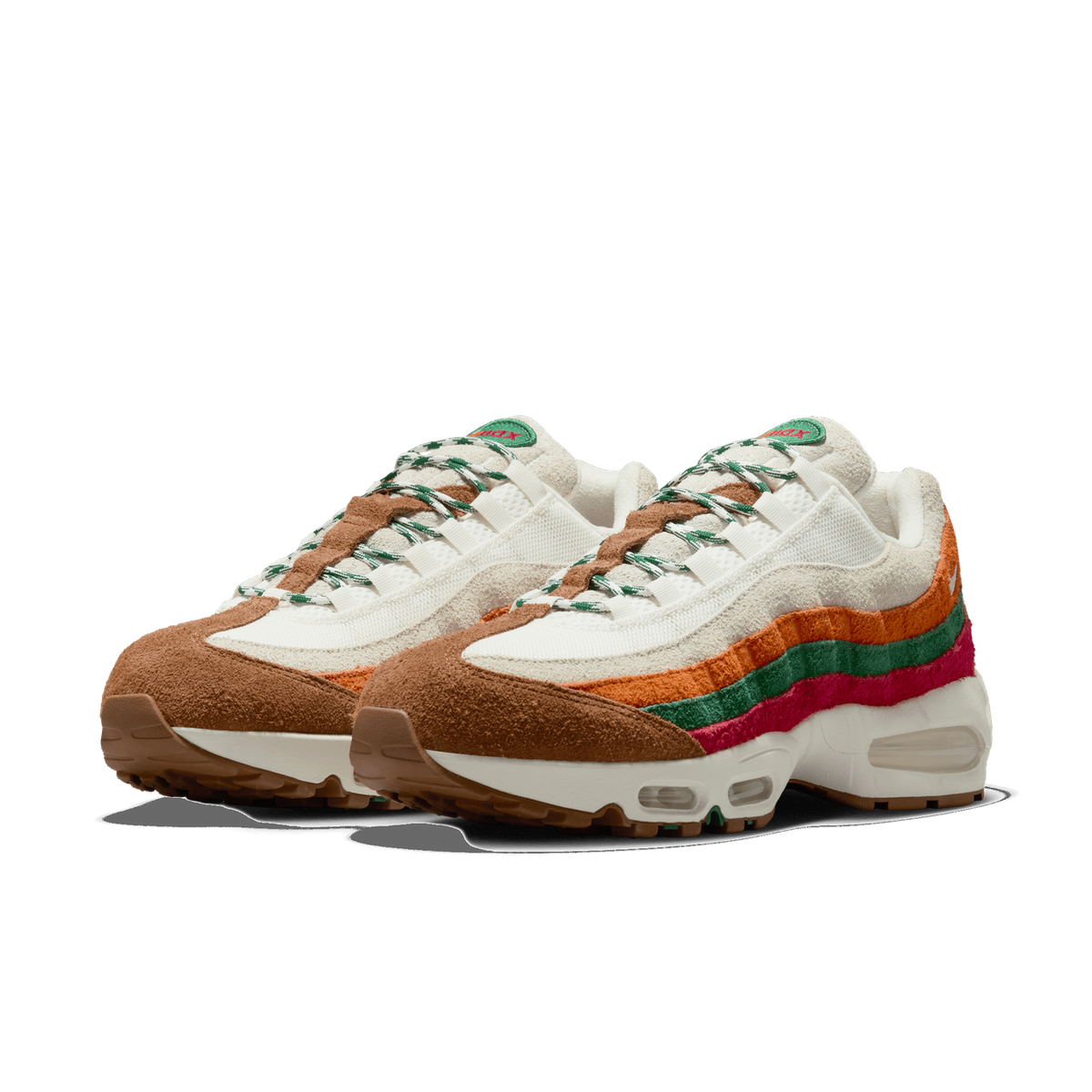 Pair of Nike Air Max 95 sneakers with brown suede toe caps, cream mesh uppers, and layered orange, green, and pink wavy side panels, shown angled toward the left.