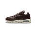 Lateral view of a dark brown leather Nike Air Max 95 with cream laces, cream midsole, and visible Max Air cushioning unit in the heel, toe pointing left