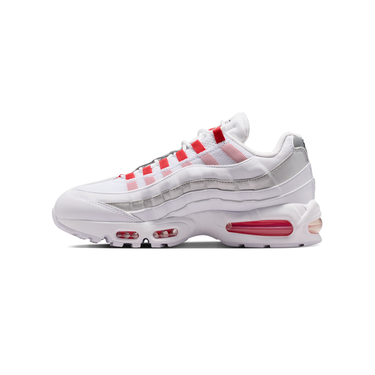 Lateral view of a white Nike Air Max 95 SE sneaker with grey layered panels, red mesh accents, red lace loops, and a visible red Air Max heel and forefoot unit.