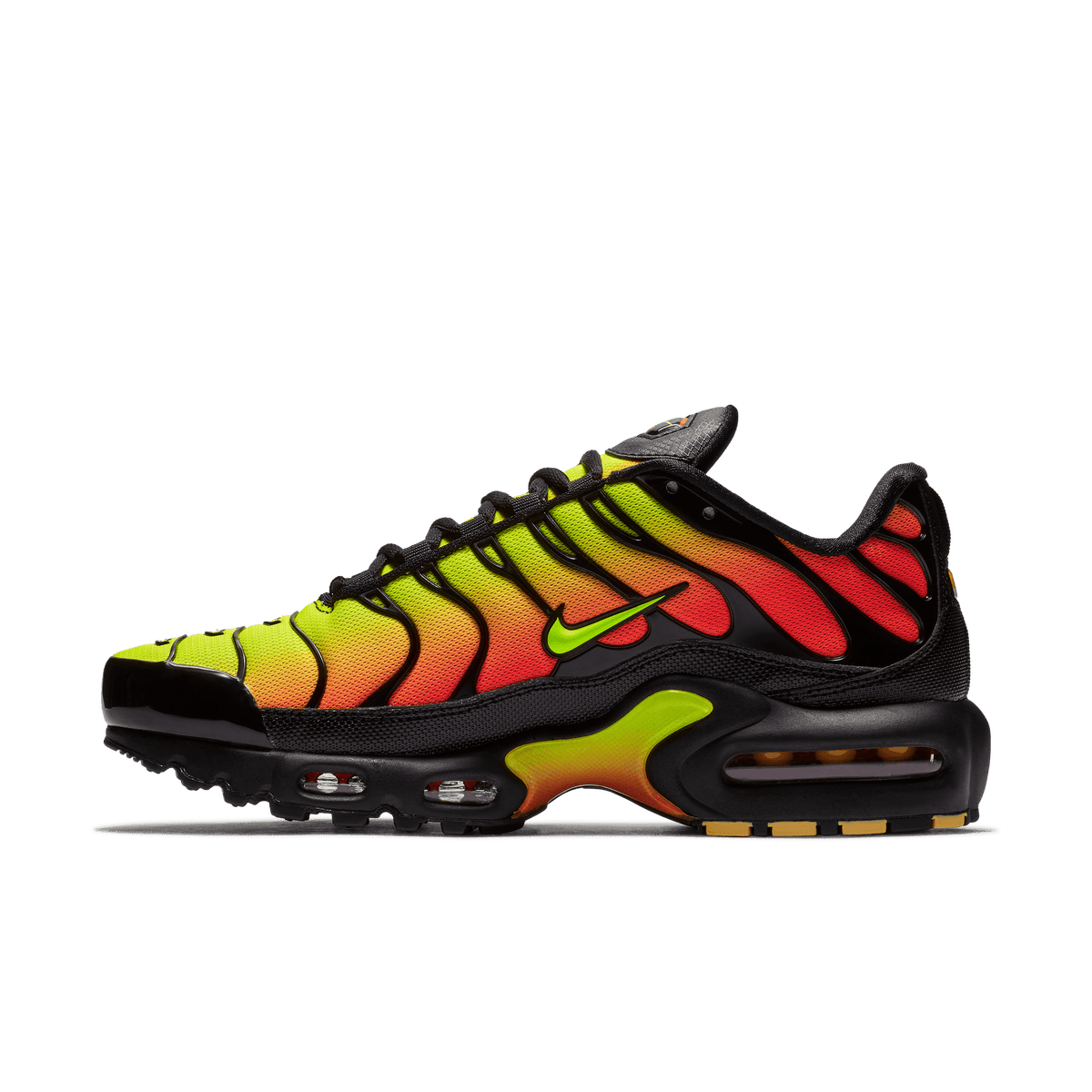 Side view of a Nike Air Max Plus sneaker with a yellow-to-red gradient tiger-stripe upper, black midsole and heel, and visible air cushioning unit along the sole.