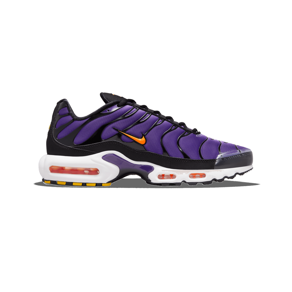 Lateral view of a purple and black Nike Air Max Plus sneaker with orange swoosh, white midsole, visible air units, and yellow outsole accents.