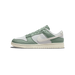 Side view of a green and white Nike Dunk Low sneaker with a white swoosh logo and cream outsole, toe pointing left.