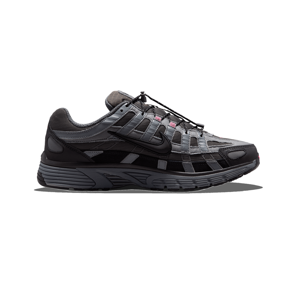 Side profile of a black and grey Nike P-6000 sneaker with pink accents, toe pointing left, showing the black Swoosh logo, bungee lace toggle and layered mesh and synthetic overlays.