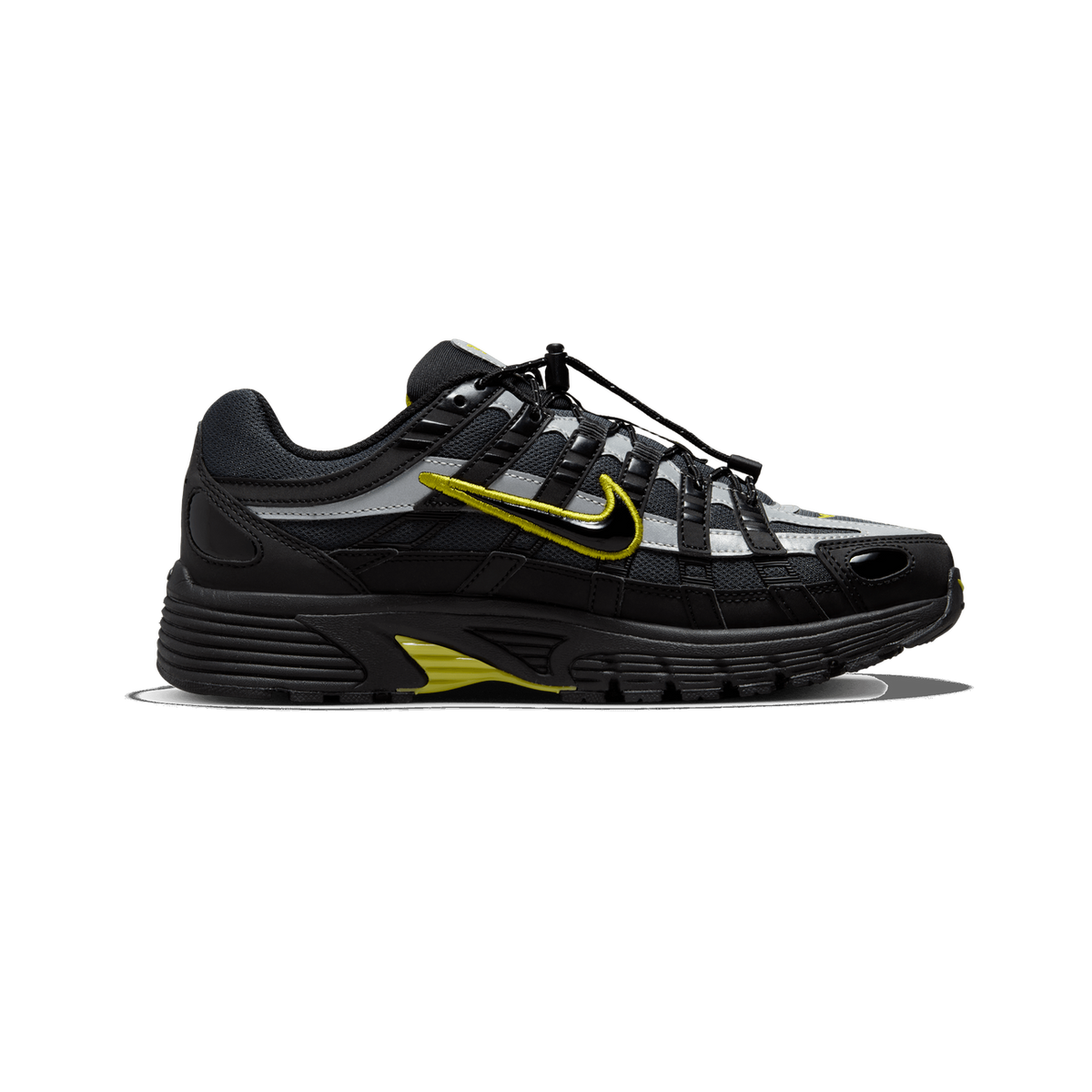 Side profile of a black, grey and yellow Nike P-6000 sneaker with the toe pointing left, showing a yellow Swoosh logo, black and silver mesh overlays, and a bungee lace cord lock.