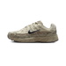 Right lateral view of a beige and tan Nike P-6000 sneaker with black swoosh, chunky ridged midsole, and P-6000 text near the heel