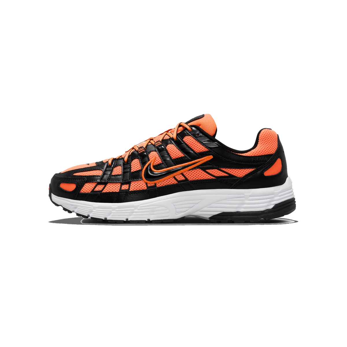 Side profile of a single Nike P-6000 sneaker with the toe pointing left, showing orange mesh panels, black leather overlays, an orange-and-black Swoosh logo on the side, and a white midsole with black outsole edge.