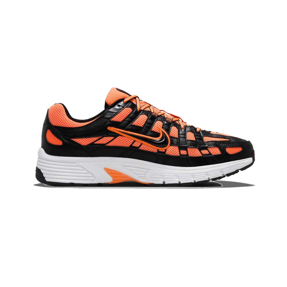 Side profile of an orange, black and white Nike P-6000 sneaker with the toe pointing left, showing orange mesh panels, black leather overlays, an orange-outlined Swoosh logo and a white midsole with orange accents.