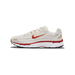 Single Nike P-6000 sneaker shown from the lateral side with the toe pointing left, featuring a cream and off-white upper, a red Swoosh logo with gold stitching, red and white midsole, and a P-6000 label on the heel.