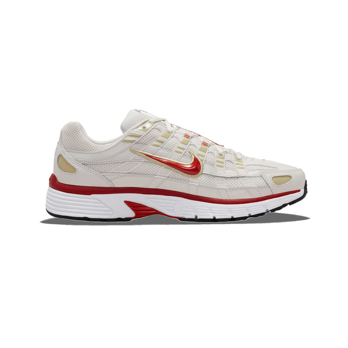 A single white and cream Nike P-6000 sneaker shown from the outside (lateral side), toe pointing left, with a red Swoosh logo, tan accents, and a red-and-white midsole against a plain white background.